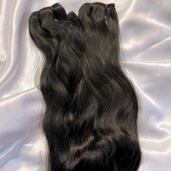 Raw hair extensions. Raw Hair bundles are unprocessed human hair sourced from single donor.